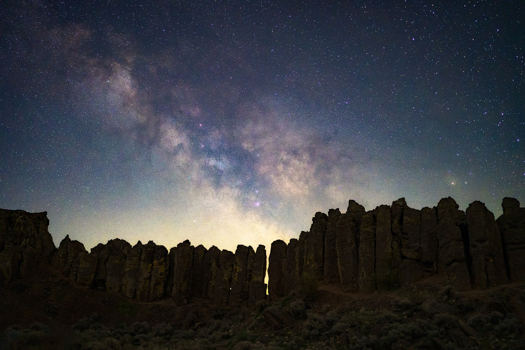 The core of the Milky Way rising over some stone pillars in eastern Washington State. Photo by Dylan McMains. Sony Alpha 7 III. Sony 35mm f/1.4 G Master. 5-sec., f/1.4, ISO 4,000